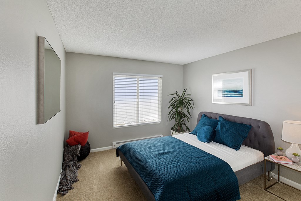 Furnished bedroom interior at OceanAire Apartment Homes, California