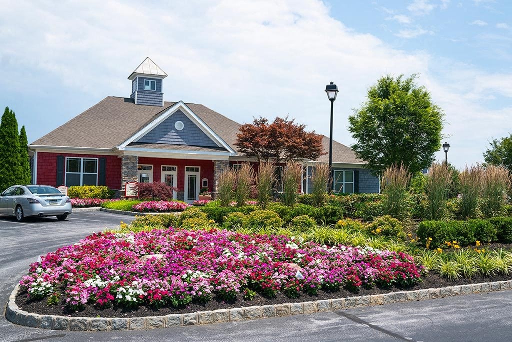 a flower garden in front of a building a flower garden in front of a building at ReNew Glenmoore, Glenmoore, Pennsylvania