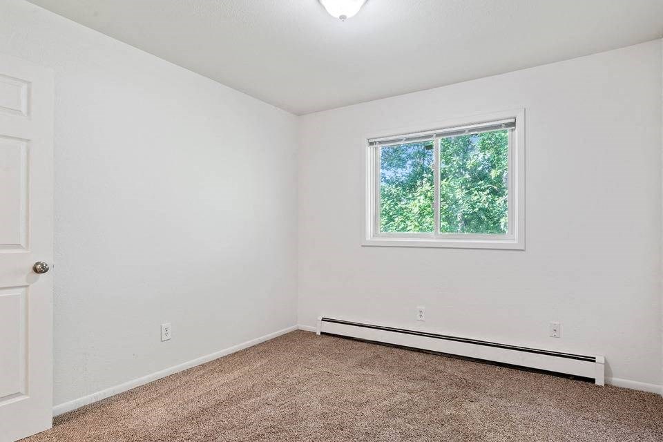 Bedroom with window at ReNew Eagle River, Eagle River