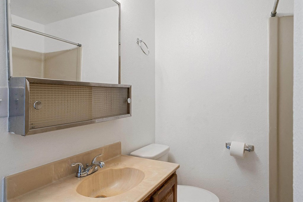 a bathroom with a sink and a toilet  at ReNew End Street, Alaska, 99577
