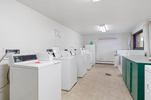 a laundry room with washers and dryers  at ReNew End Street, Eagle River, AK, 99577