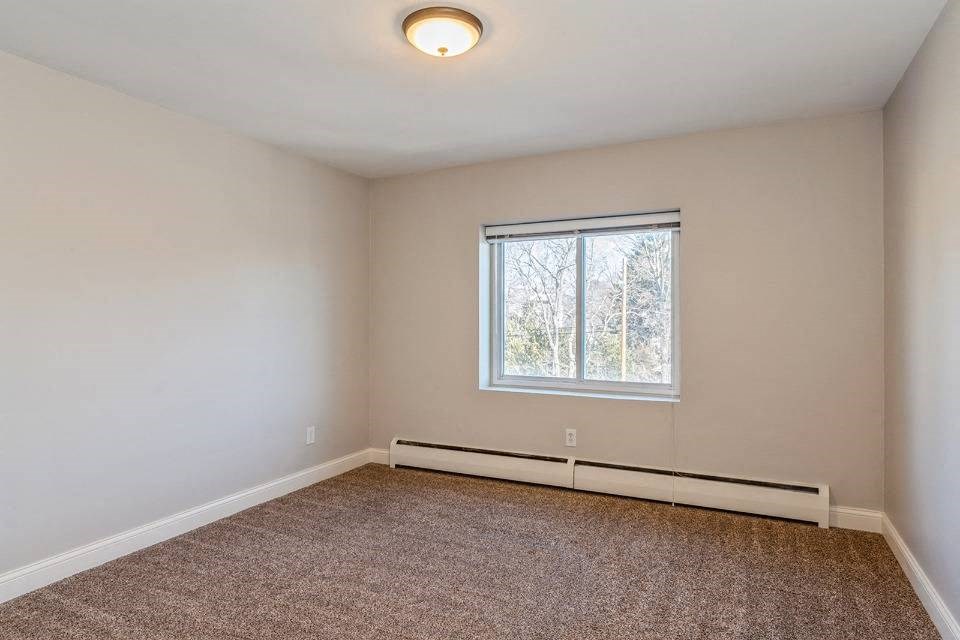 Bedroom With Carpet at Cove at Linden Hills, Minneapolis, Minnesota