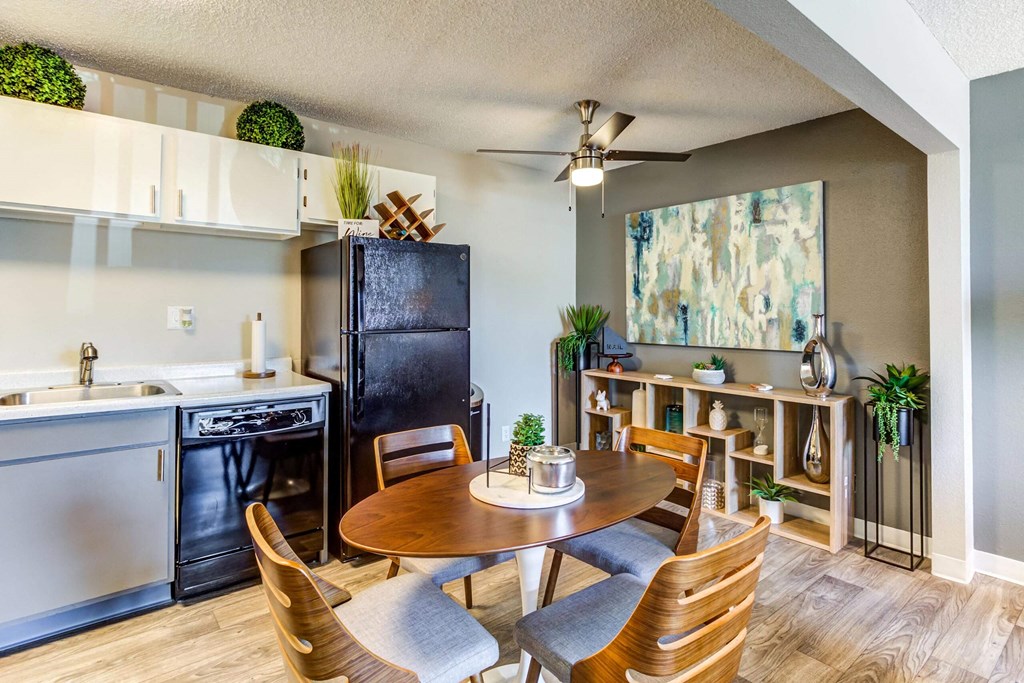 a kitchen and dining area in a 555 waverly unit  at ReNew at Neill Lake, Eden Prairie, MN