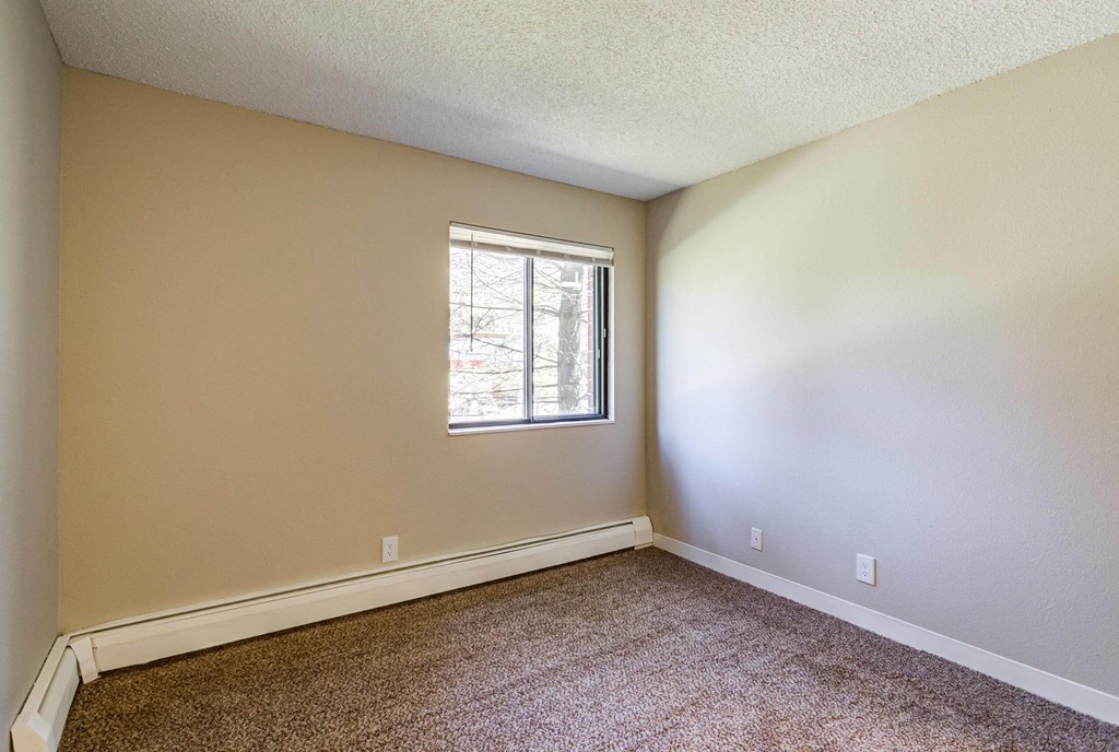 a bedroom with carpet and a window  at ReNew at Neill Lake, Eden Prairie, MN, 55344