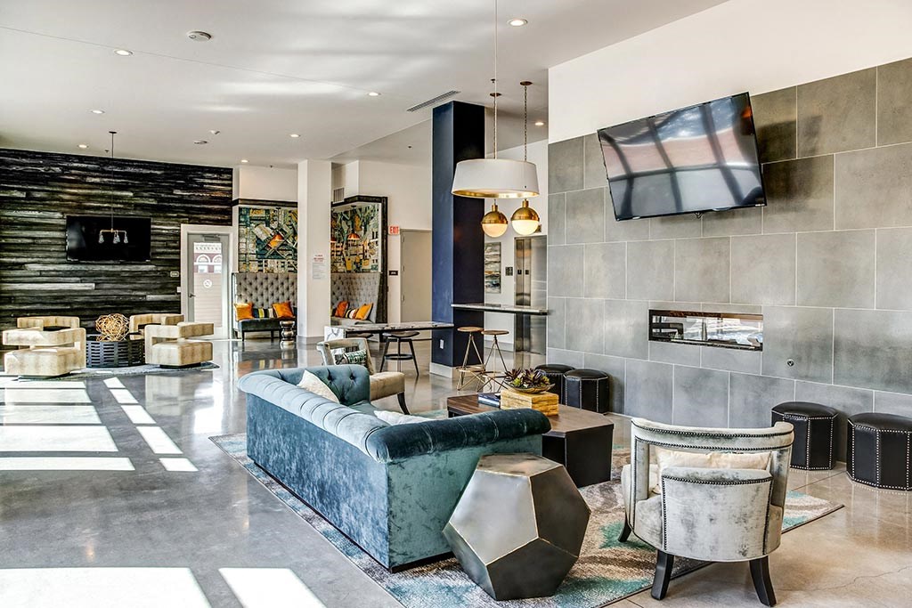 a living room filled with furniture and a flat screen tv