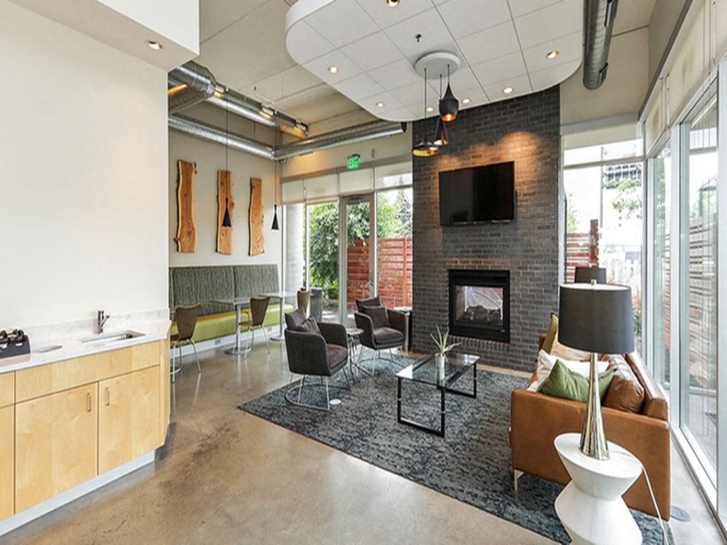 a living room with a couch and a fireplace