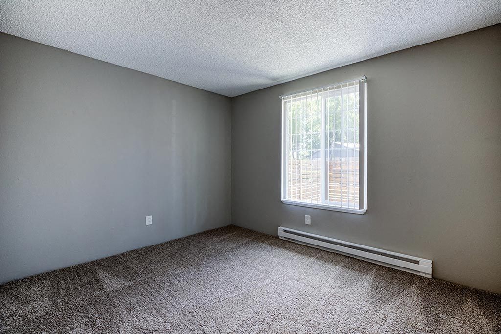an empty room with a large window