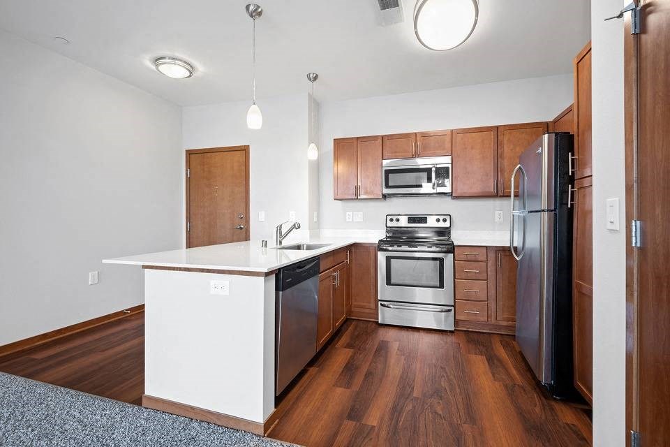 Kitchen with appliances at 1910 on Water, Milwaukee, 53202