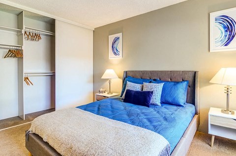 a bedroom with a bed and two night stands