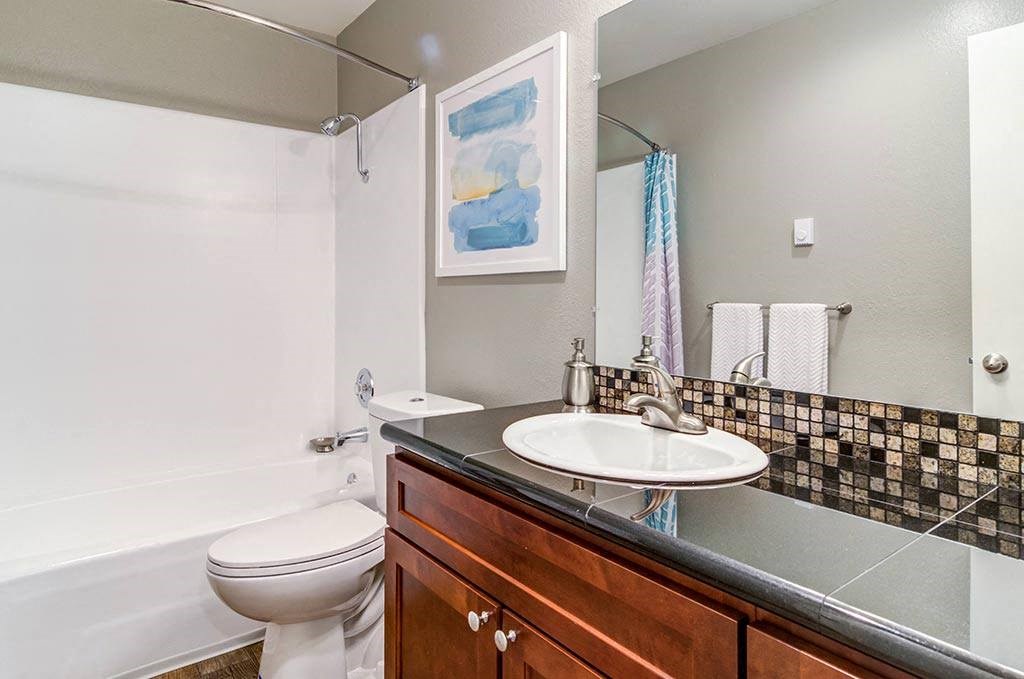 a bathroom with a sink toilet and bathtub at The Bluffs at Mountain Park, Oregon, 97035