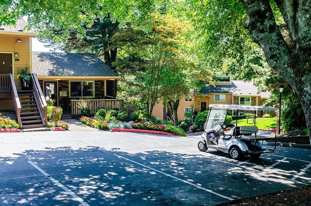 a golf cart parked in front of a house  at The Bluffs at Mountain Park, Lake Oswego, OR