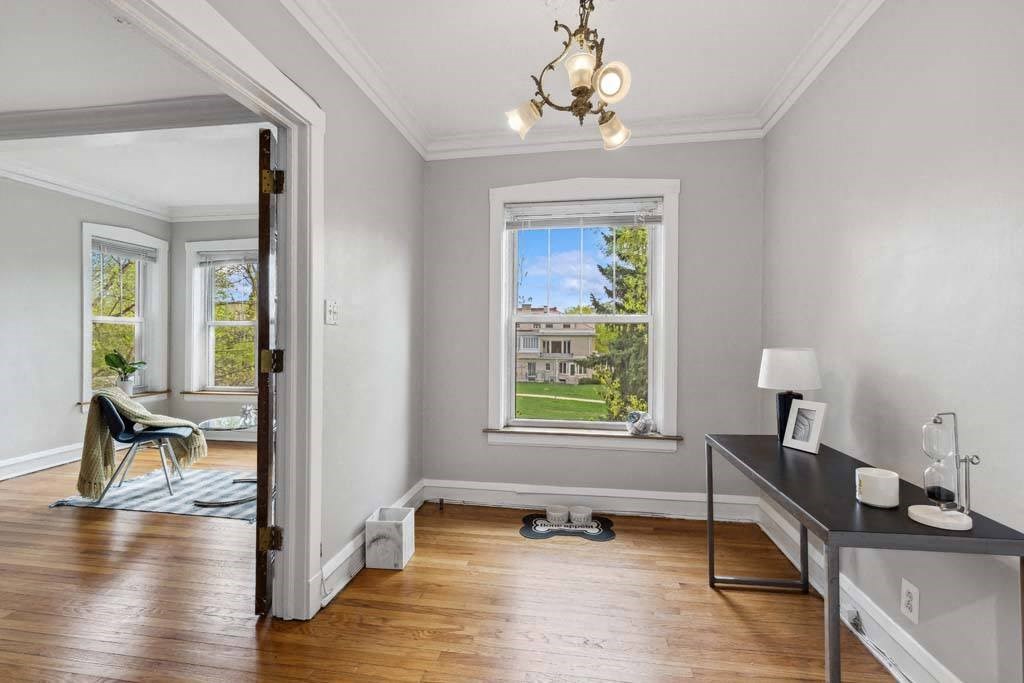 a living room with a window and a table at The Bryant at Oak Park I & II, Oak Park Illinois