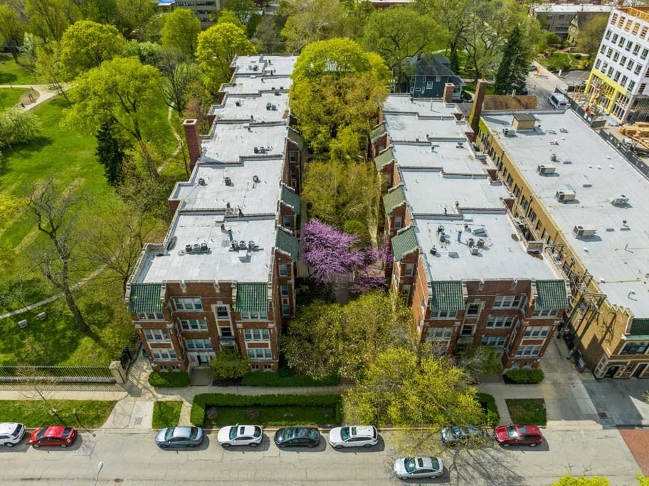 an aerial view of a building next to a parking lot at The Bryant at Oak Park I & II, Oak Park, IL