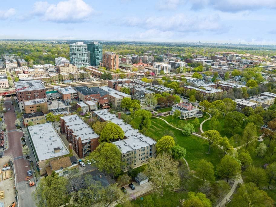 an aerial view of a city with buildings and trees at The Bryant at Oak Park I & II, Illinois
