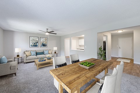 A dining room with a wooden table and chairs.
