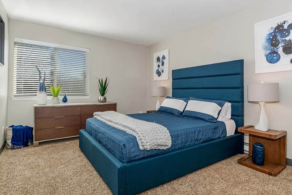 Bedroom with a bed and a dresser at Renew Madison, Madison