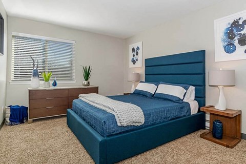 Bedroom with a bed and a dresser at Renew Madison, Madison