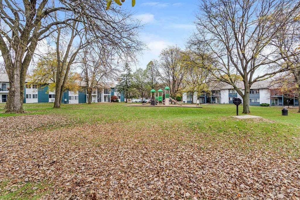 Park with trees and buildings in the background at Renew Madison, Madison, Wisconsin