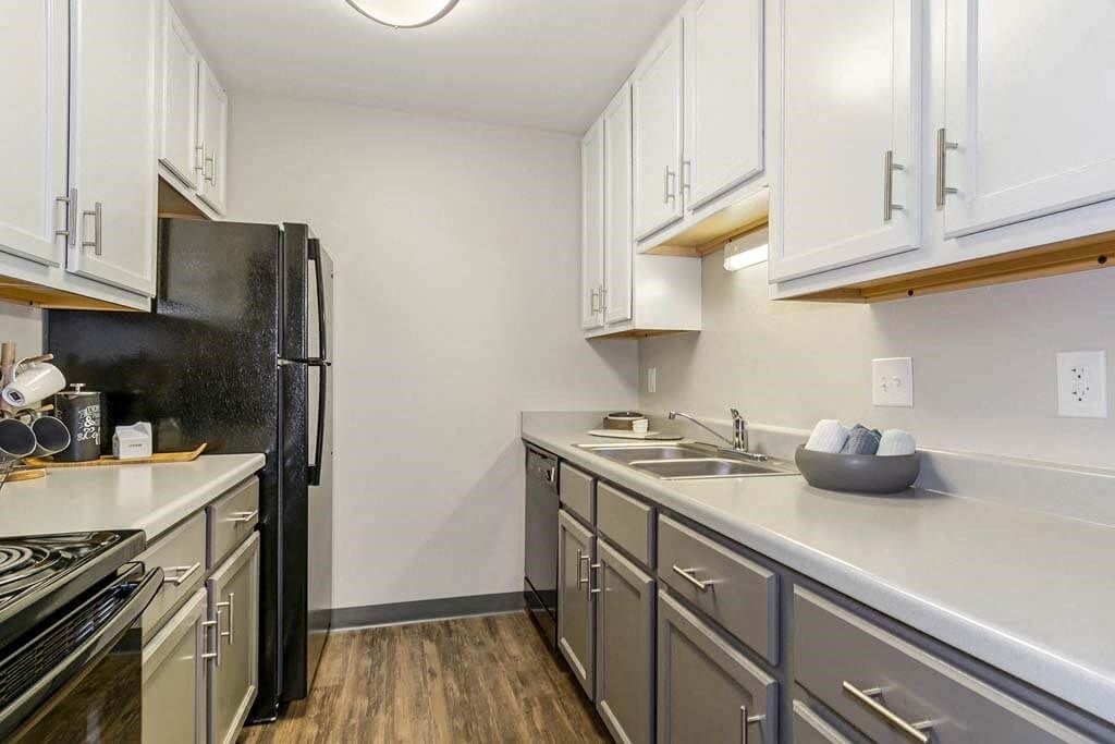 Kitchen with a stove top oven next to a refrigerator  at Renew Madison, Madison, 53711