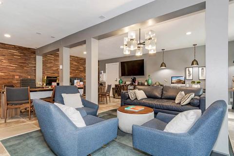 a living room filled with furniture and a flat screen tv at Renew Madison, Wisconsin, 53711