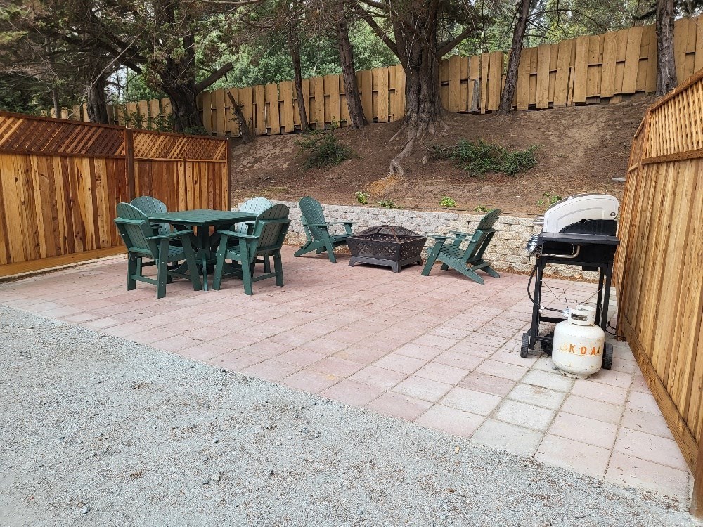 A patio with a table and chairs and a gas grill at Salinas Sunset Apartments, Salinas, California