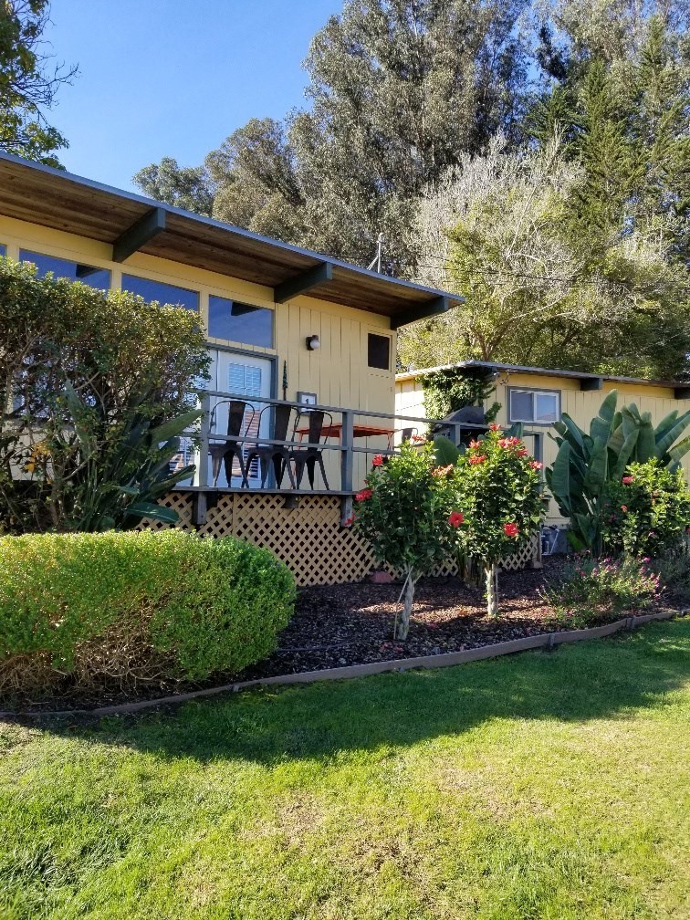 yellow cabin with deck and landscaping at Salinas Sunset Apartments, California, 93907