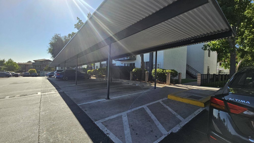 a car parked under awning in a parking lotat Alturas Paso Robles Apartment Homes, Paso Robles, CA, 93446