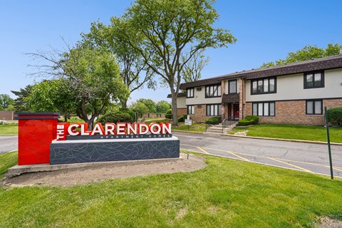 The Clarendon sign is in front of a building.
