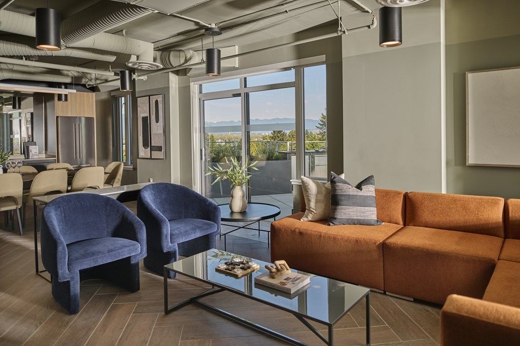 A modern living room with a view of the ocean.