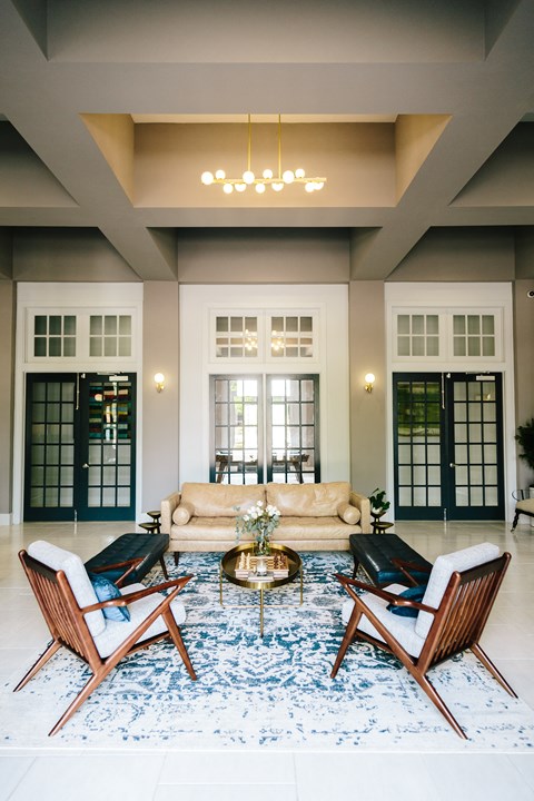 a living room with a couch and two chairs
