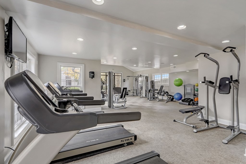 a gym with treadmills and other exercise equipment at Veridian Sandy Springs