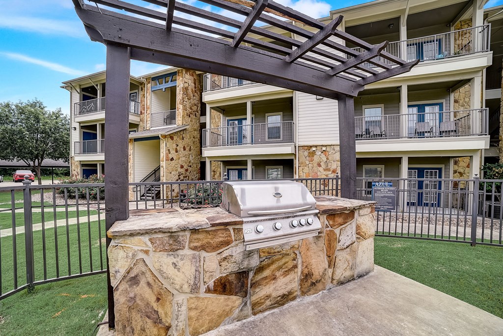 bbq grill in an outdoor lounge at azul apartment homes