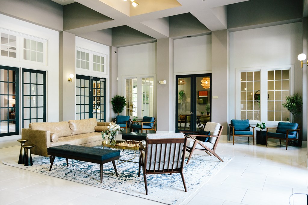 Tapestry at Hollingsworth Park club house with a couch and chairs and a rug