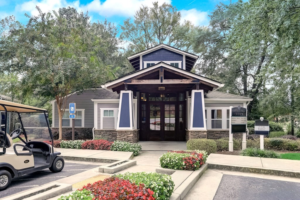 Front entrance leasing office Wynnwood Vinings Atlanta with a golf cart in front of it