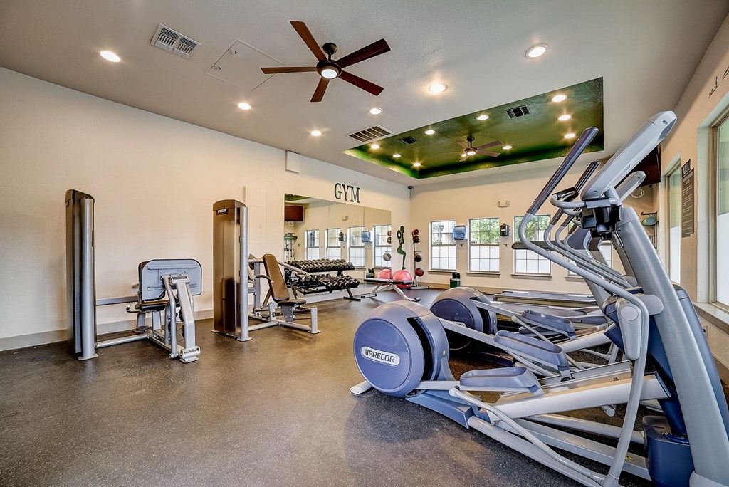 a gym with a variety of exercise equipment