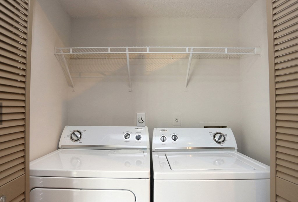 In-unit full sized laundry machines with folding doors