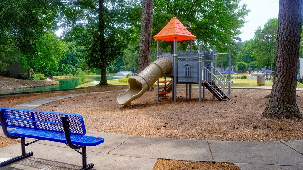 Our playground with a slide and a climbing structure in a park