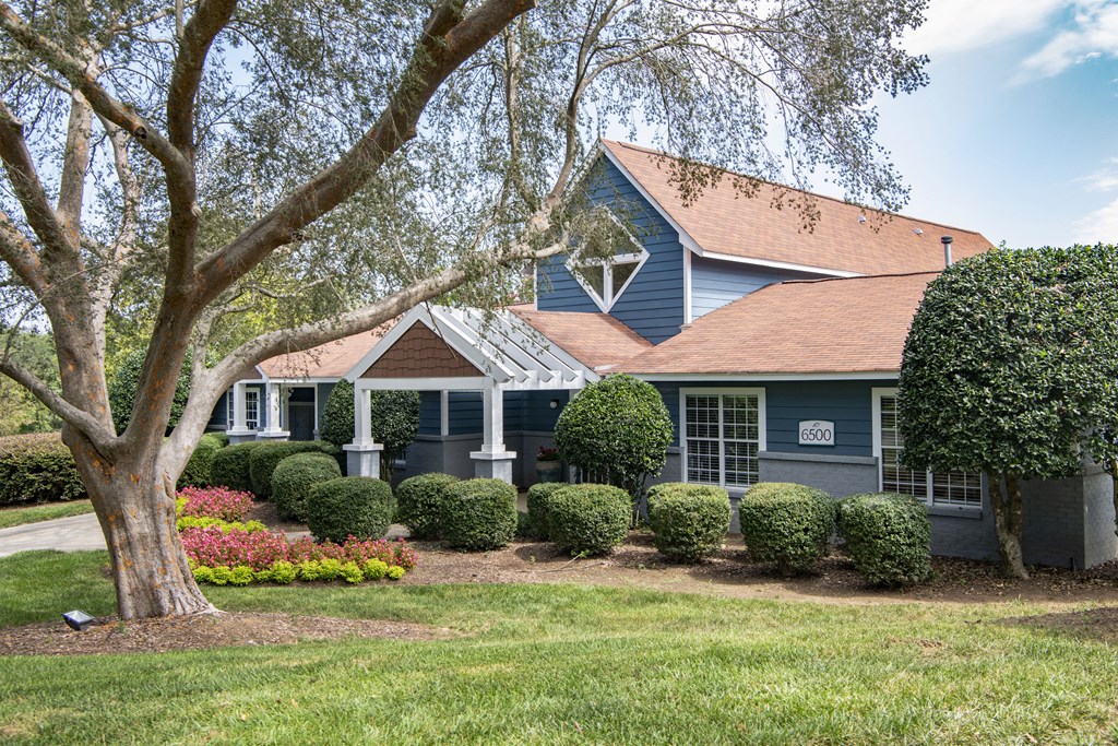 a house with a large tree in front of it