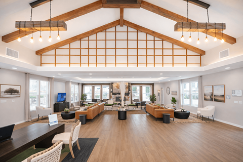 A large open space with a long table and chairs.