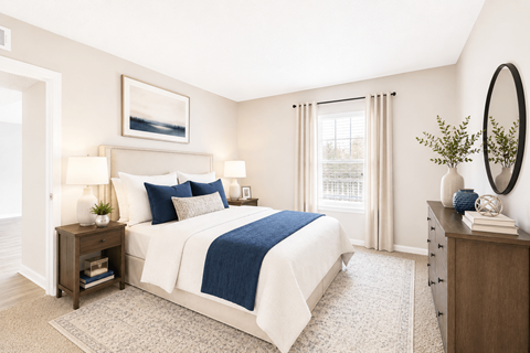 Sandy Springs, GA, Apartments with In-Unit Washer and Dryer - Veridian at Sandy Springs - Bedroom With A White Bed, Wood Nightstands, Large Window, Dresser, Round Mirror, And Neutral Decor.