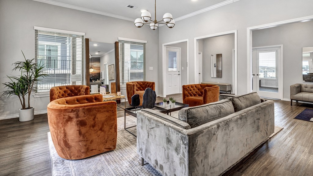 a living room with couches and chairs and a table