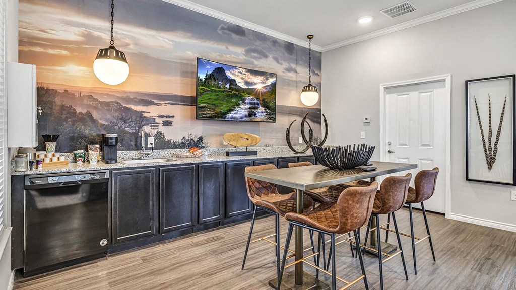 an open kitchen and dining room with a table and chairs
