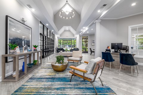 A modern living room with a large rug and a wooden chair.