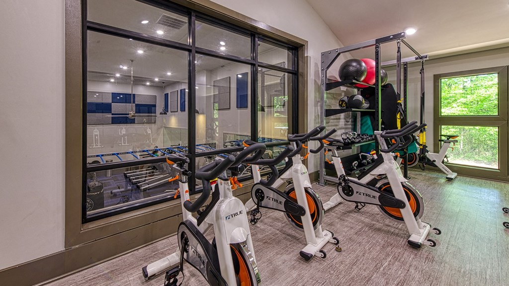 Wynnwood Vinings two story fitness center interior room filled with lots of bikes and exercise equipment