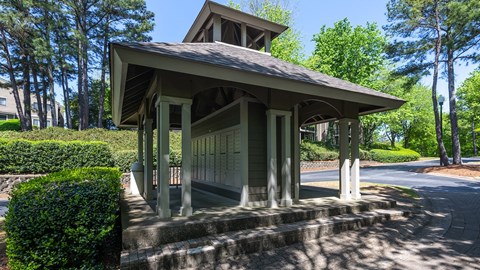 Mail station at Wynnwood Vinings Atlanta with trees and bushes in the background