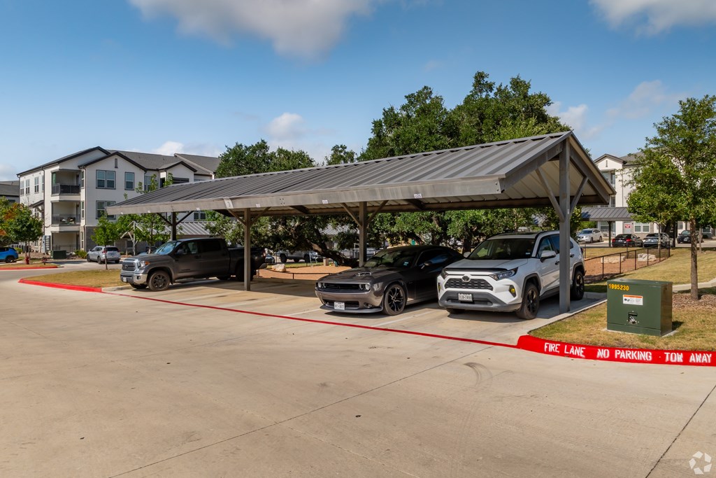 A parking lot with a sign that says "Free Lane No Parking Ton Away".