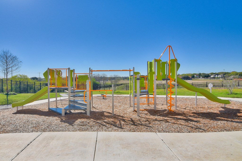 a newly renovated childrens playground at the heights at converse apartments in texas
