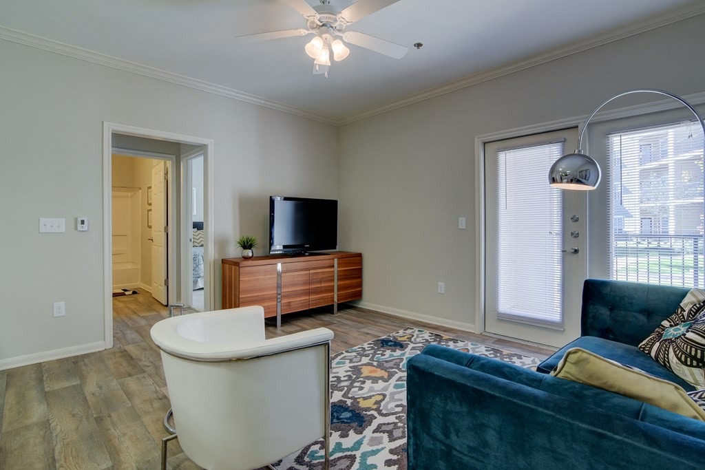 heights at converse apartments living room with rug chairs and TV