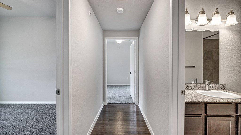 the retreat apartments renovated bathroom with sink and mirror