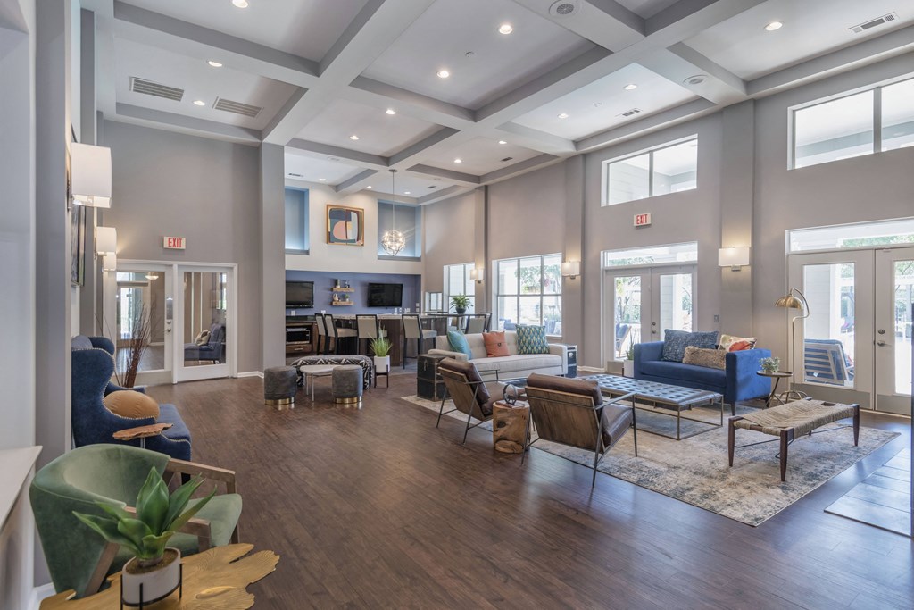 a Leasing Center interior room filled with furniture and a large window